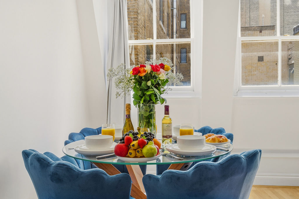 Dining table with flowers by the window